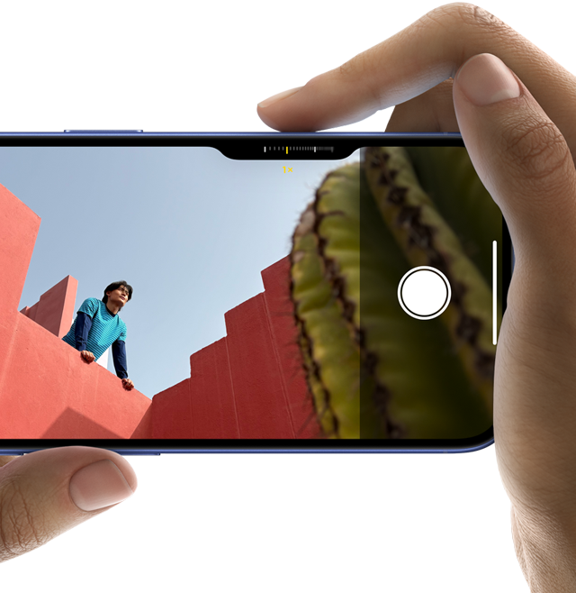 Camera Control on iPhone 16, right finger slides along side of phone to adjust camera settings